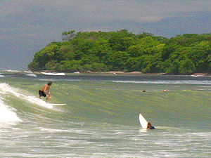 Surfing at Playa Los Cedros, between Montezuma and Cabuya